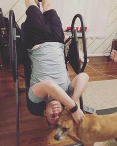 Me on the inversion table getting interrupted by my dog