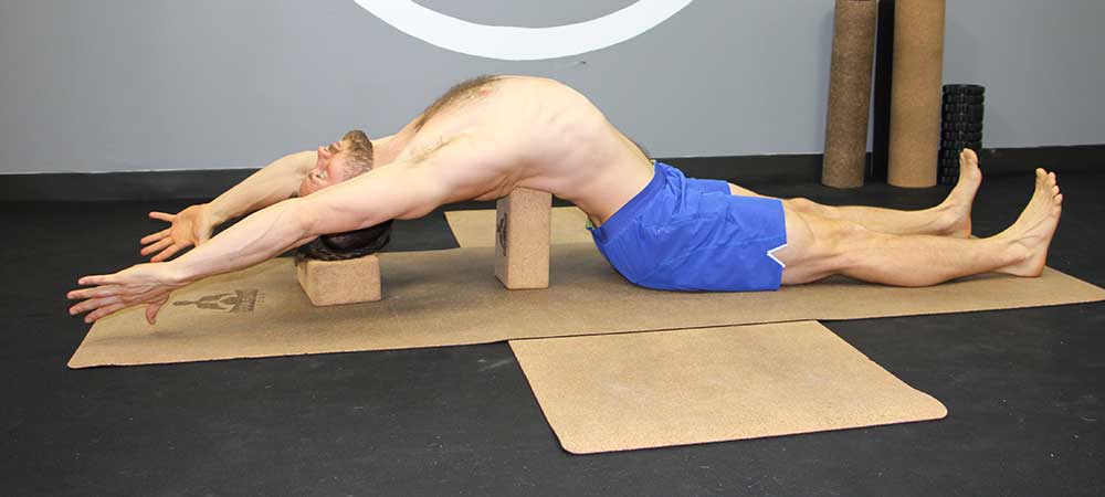 Restorative Poses for chest with yoga block