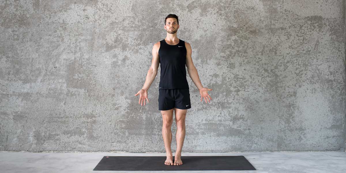 Dean Pohlman in Mountain pose demonstrating for people starting beginner yoga for men
