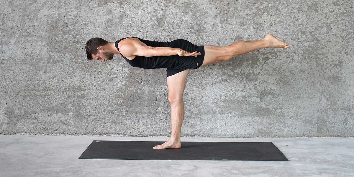 Dean Pohlman in airplane pose demonstrating for people starting beginner yoga for men