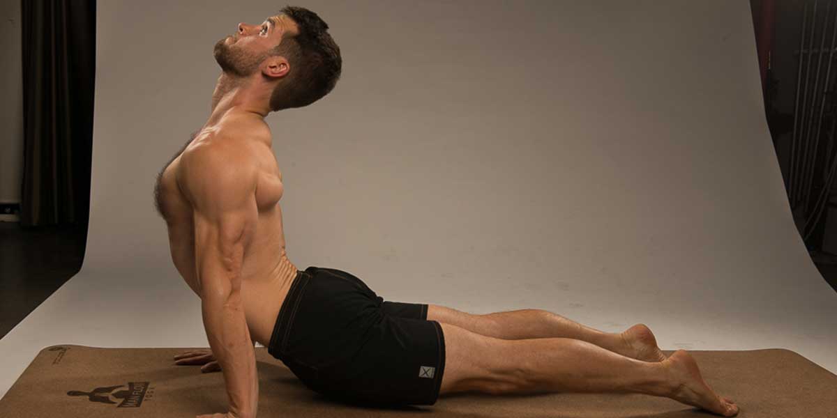 Dean Pohlman in Updog pose demonstrating for people starting beginner yoga for men
