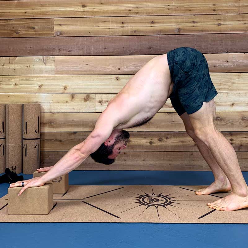 A yoga pose not going as deep into downdog demonstrated for people starting begginner yoga for men