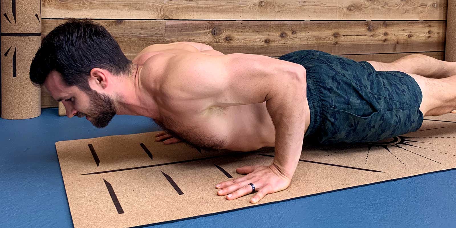 Dean Pohlman demonstrating a yoga push up for people starting begginner yoga for men