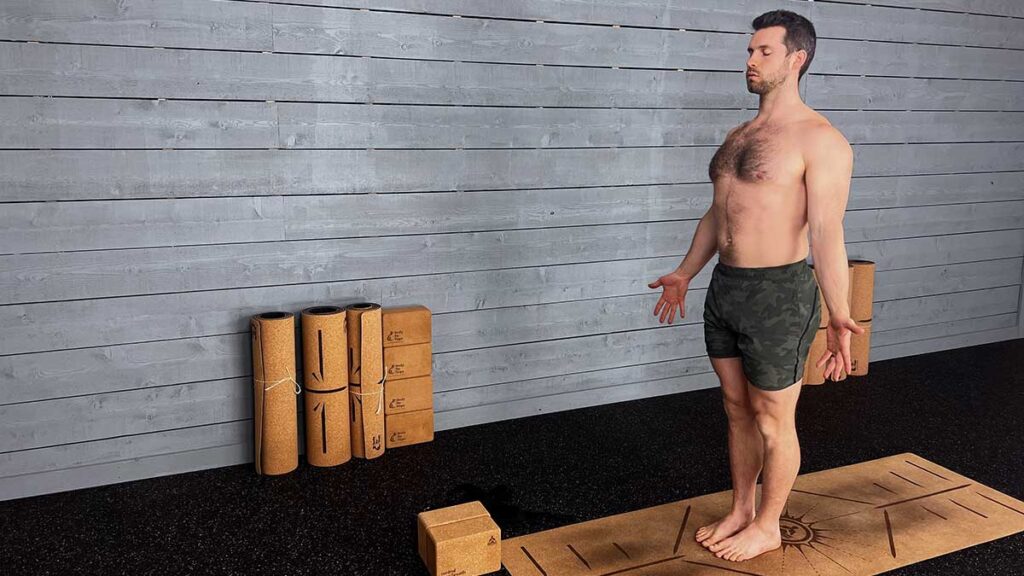 Shirtless Male Yoga Instructor Demonstrating Mountain Pose for Mindfulness