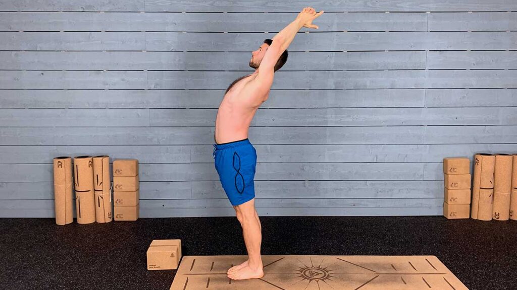Shirtless Male Yoga Instructor Demonstrating Standing Back Bend Pose for Better Breathing
